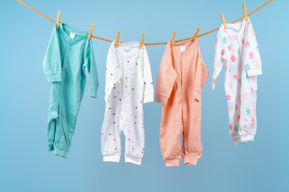 What are the important things to consider when buying clothes for newborns?
