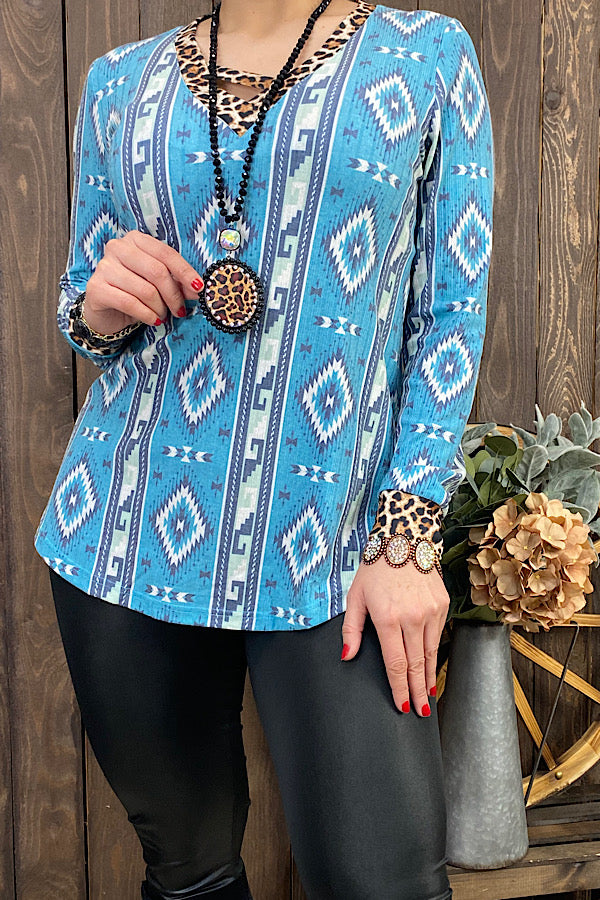 GJQ11338 Blue Aztec & leopard printed long sleeve top w/criss cross neckline